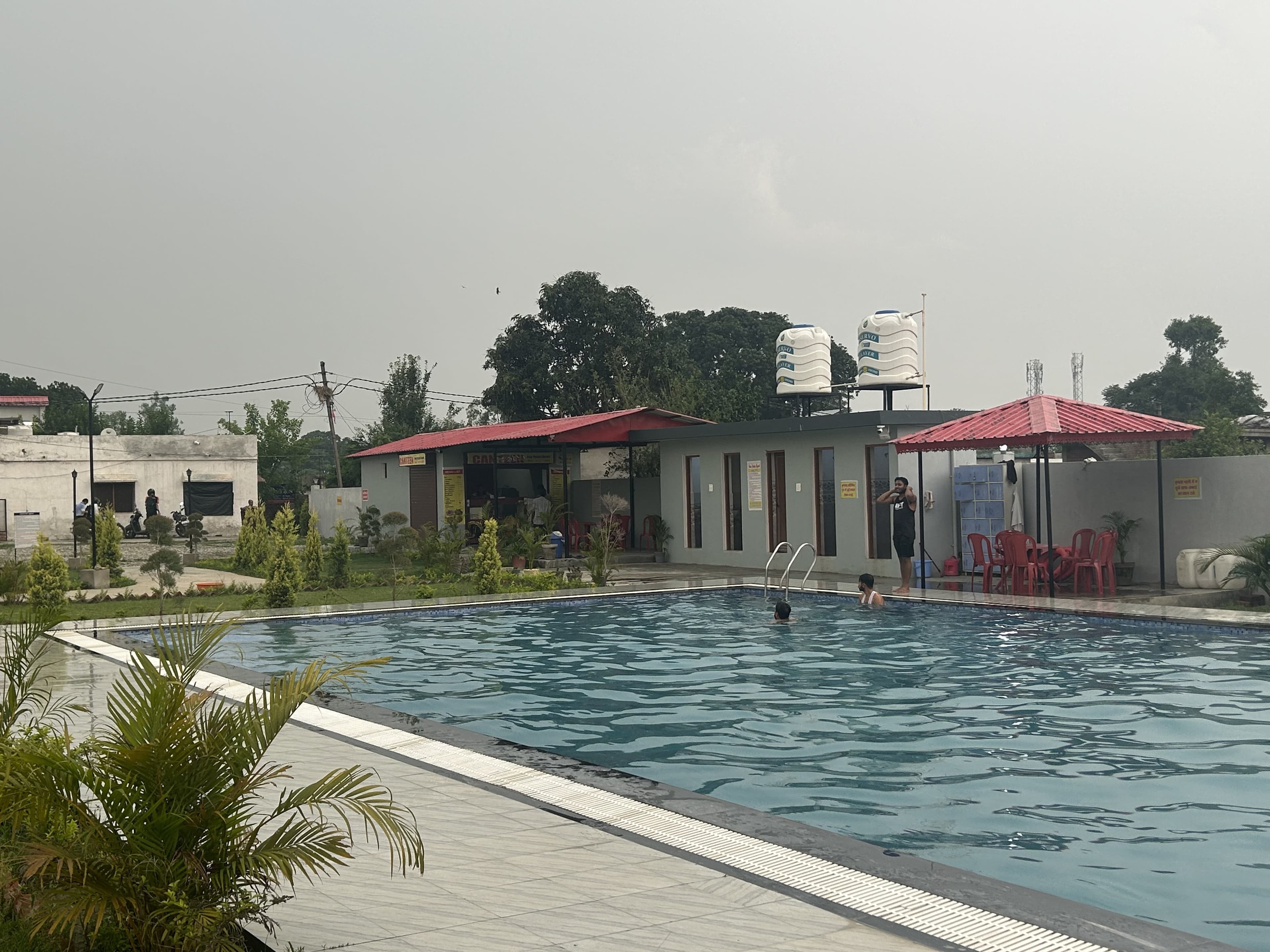Four Points Resort swimming pool and lawn in Dehradun